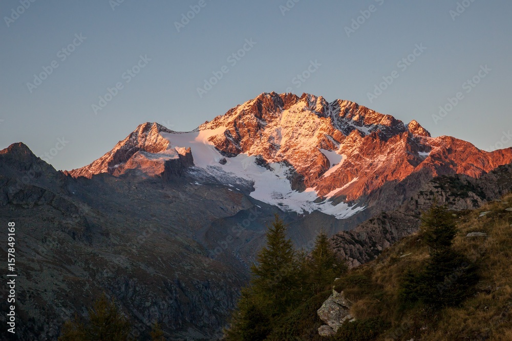Sunset on the southernside of Mount Disgrazia. Scermendone Alp Raethian Alps, Valtellina, Lombardy, Italy Europe