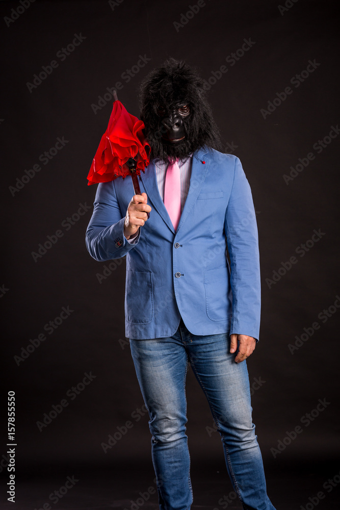 businessman wearing gorilla mask