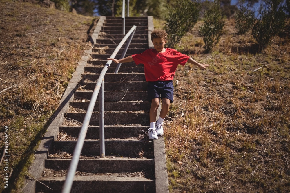 Boy moving down during obstacle course Boy moving down during obstacle course