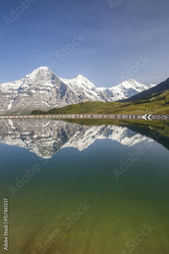 Mount Eiger reflected in clear waters of a lake Mannlichen Grindelwald Bernese Oberland Canton Bern Switzerland Europe