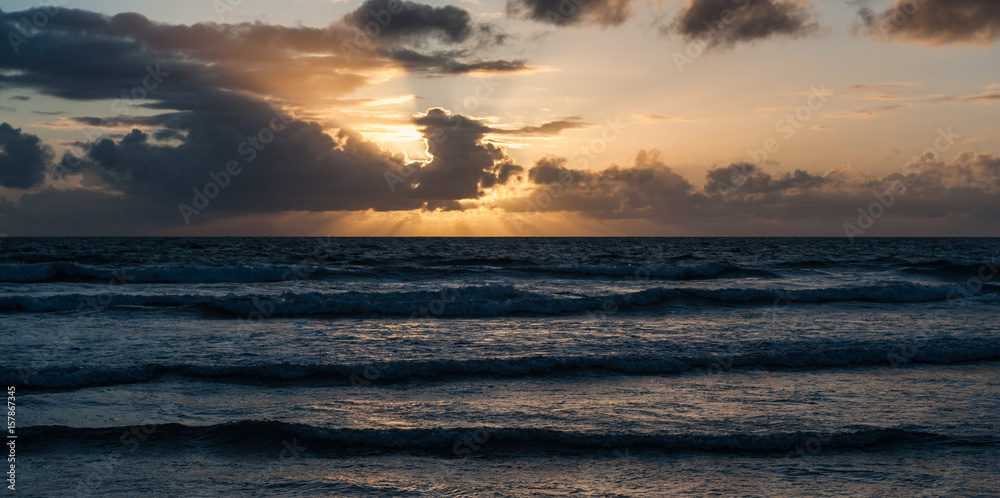 Stormy ocean sunset panorama