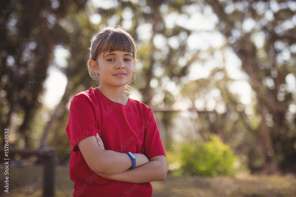Portrait of confident girl standing with arms crossed Portrait of confident girl standing with arms crossed
