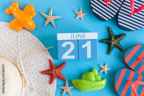 June 21st. Image of june 21 calendar on blue background with summer beach, traveler outfit and accessories. Summer day