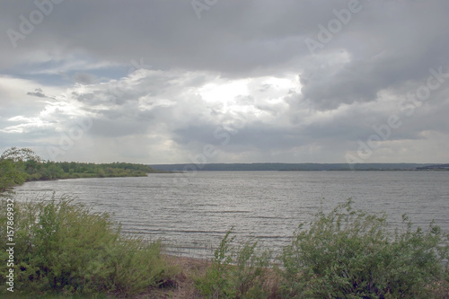 river and dark clouds