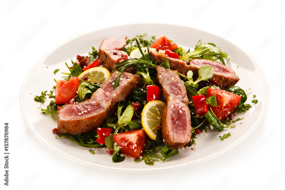 Beef with vegetables on white background