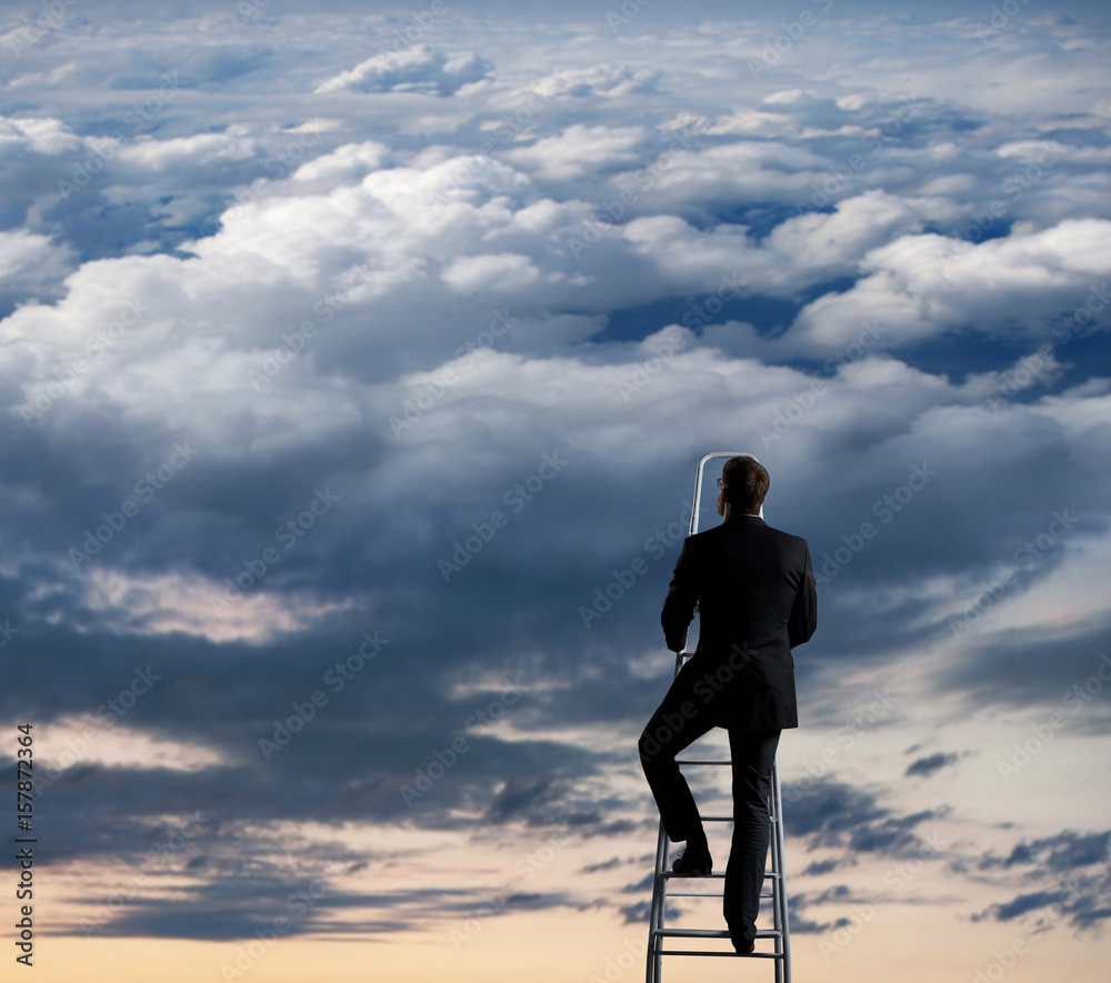 Businessman standing on ladder high in sky. Business concept.