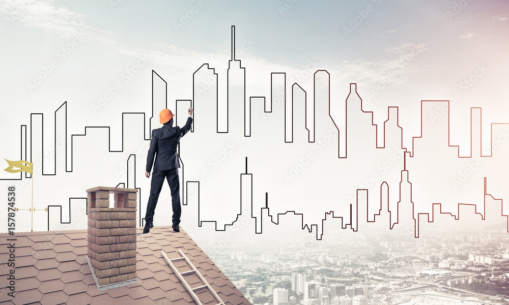Man architect draw silhouette of modern city on blue sky. Mixed Man architect draw silhouette of modern city on blue sky. Mixed
