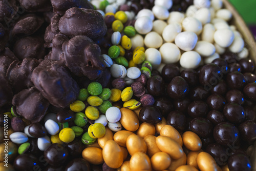 Assorted from a variety of different sweets in the glaze of white and dark chocolate  in the sugar glaze.