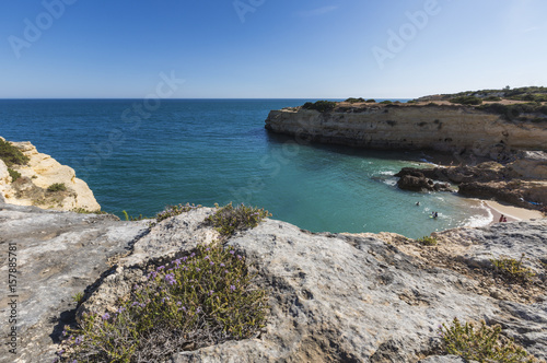 The turquoise water of the ocean surrounded by cliffs at Praia De Albandeira Algarve Lagoa Faro District Portugal Europe