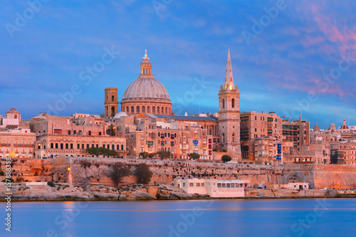 Valletta Skylineat at beautiful sunset from Sliema with churches of Our Lady of Mount Carmel and St. Paul's Anglican Pro-Cathedral, Valletta, Capital city of Malta