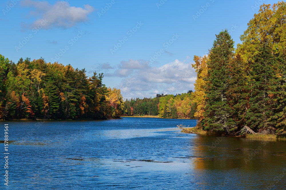 Autumn foliage along a river in rural Prince Edward Island, Canada. Autumn foliage along a river in rural Prince Edward Island, Canada.