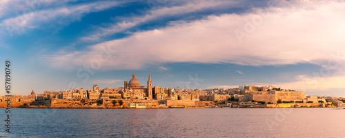 Panoramic view of Valletta Skylineat at beautiful sunset from Sliema with churches of Our Lady of Mount Carmel and St. Paul's Anglican Pro-Cathedral, Valletta, Capital city of Malta