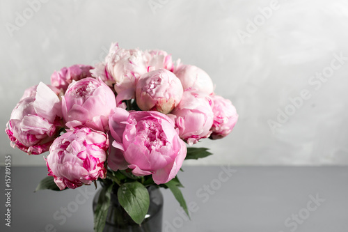 Fototapeta Naklejka Na Ścianę i Meble -  Pink peony flower on a gray background.copy space