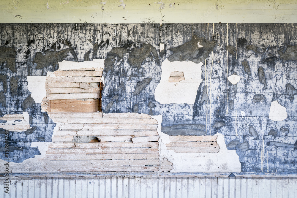 weathered plaster wall in an abandoned school