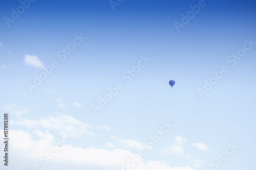 Hot air balloon on blue sky background