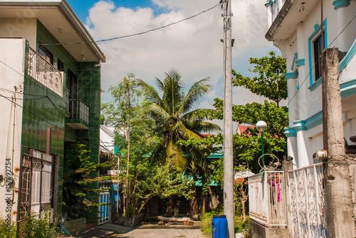 Local street with houses in the Philippines capital Manila