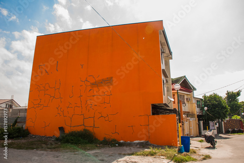 Local street with houses in the Philippines capital Manila photo