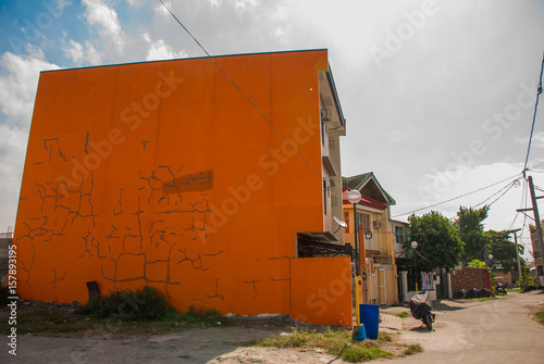 Local street with houses in the Philippines capital Manila photo