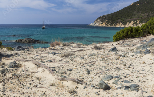 Sailboat in the turquoise sea around the beach of Porto Sa Ruxi Villasimius Cagliari Sardinia Italy Europe