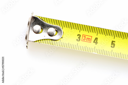 End of yellow tape measure with metal tip