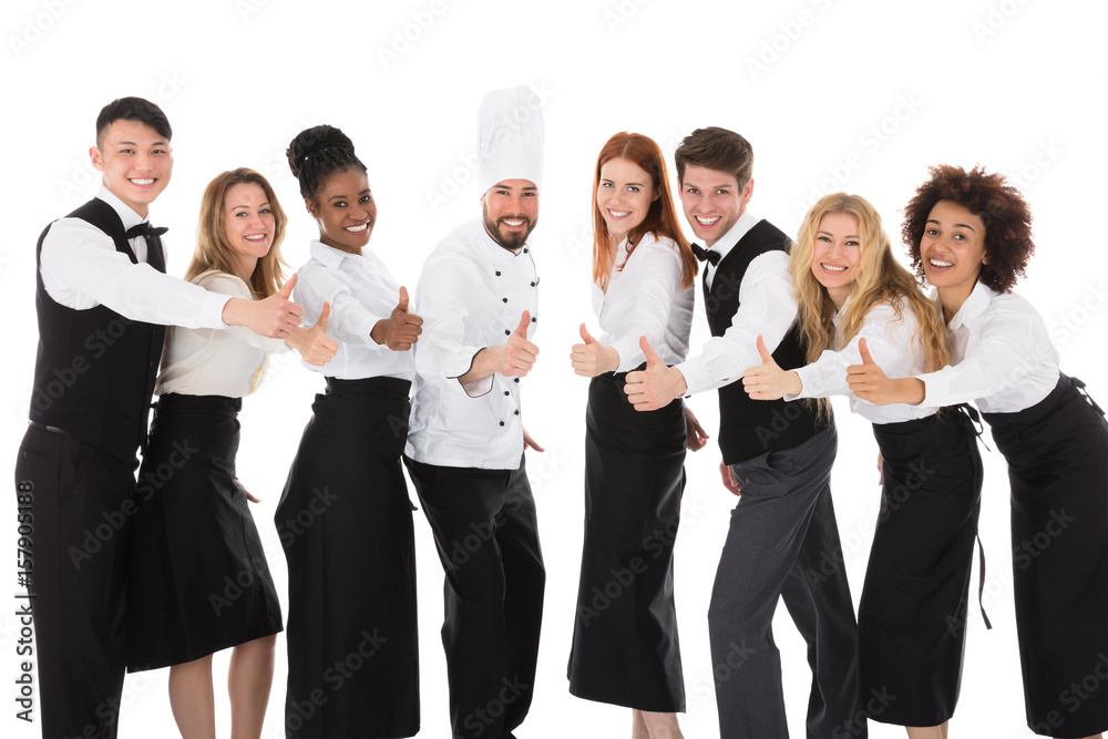 Smiling Restaurant Staff Gesturing Thumbs Up Smiling Restaurant Staff Gesturing Thumbs Up