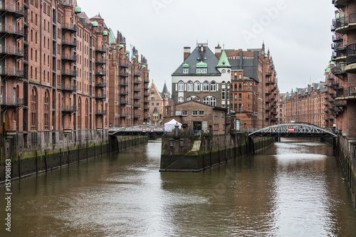 The picturesque water castle between bridges in the center of the canal PoggenmÃ¼hlenbrÃ¼cke Altstadt Hamburg Germany Europe
