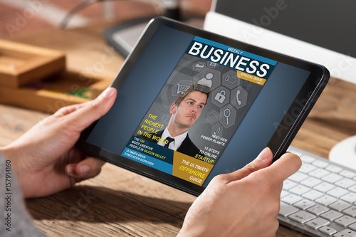Businessperson Looking At Business Magazine