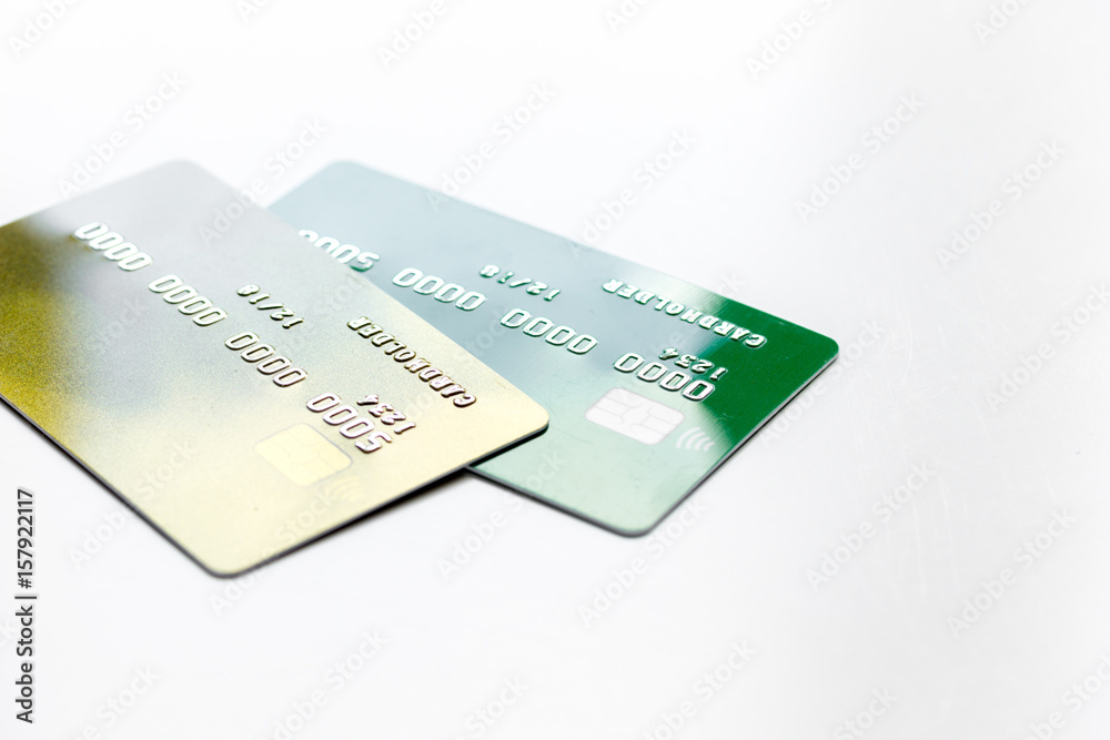work place with business credit cards for payment on white desk background close up work place with business credit cards for payment on white desk background close up