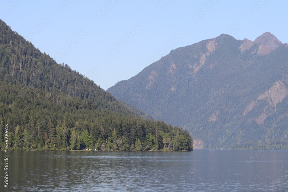 blue sky mountain forest over lake