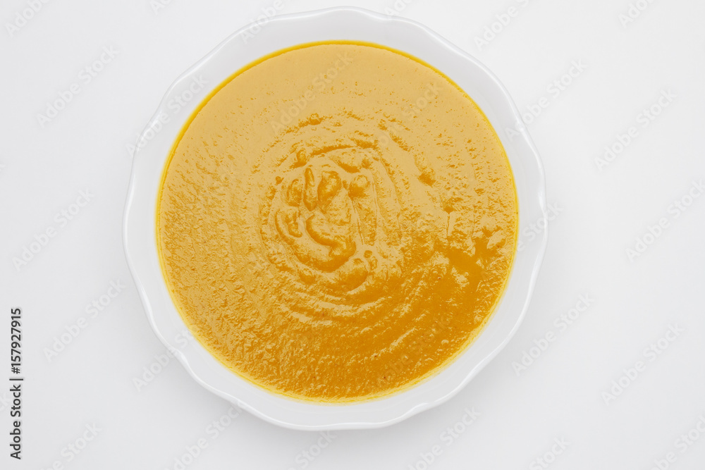 Plate of pea cream soup on white background Plate of pea cream soup on white background