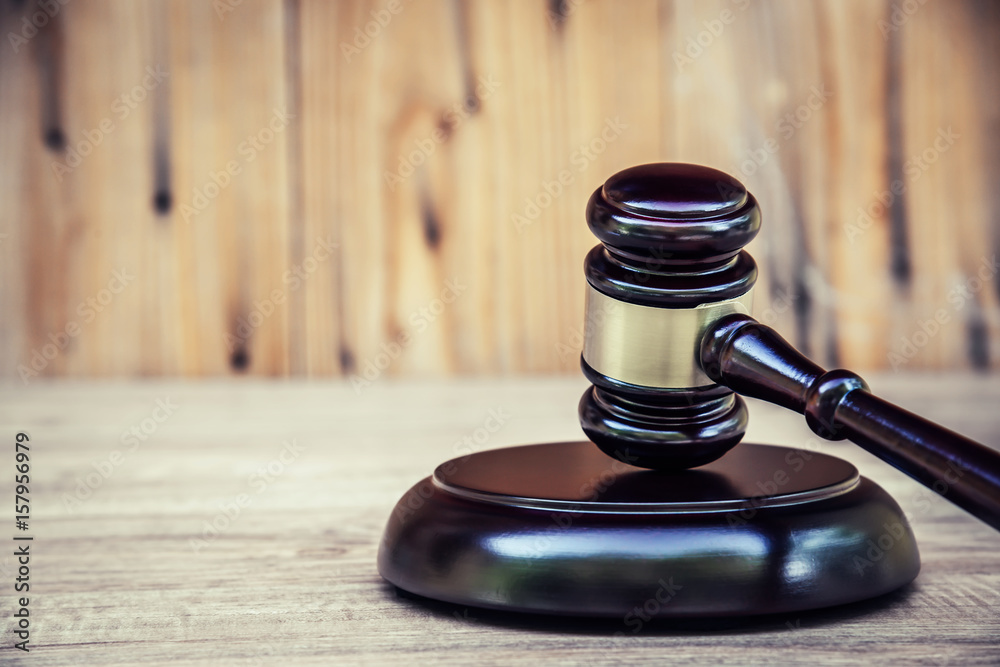 Wooden judge gavel and soundboard .