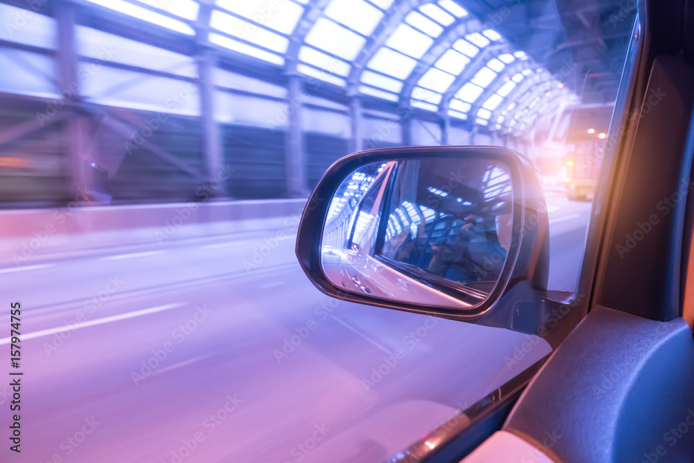 Car driving on to tunnel.