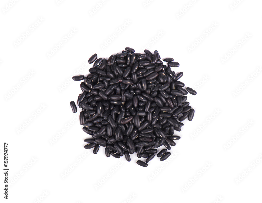 Small handful of black beans. Beans isolated on a white background. Close-up. Top view Small handful of black beans. Beans isolated on a white background. Close-up. Top view