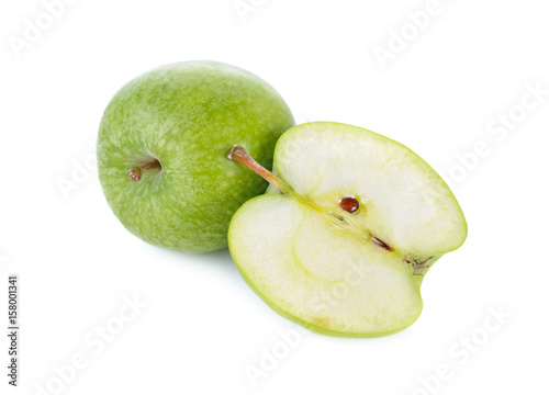 whole and half cut fresh green apple with stem on white background