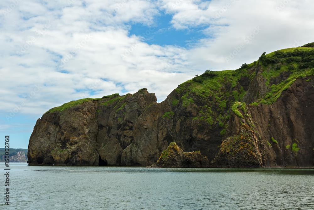 Obraz premium Rocks in Avacha Bay of the Pacific Ocean. The coast of Kamchatka.