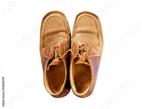 male brown old leather shoes isolated on a white, top view