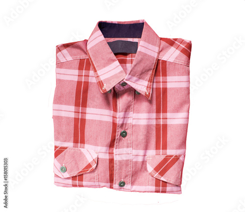 red checkered shirt  folded isolated on white background © Saichol