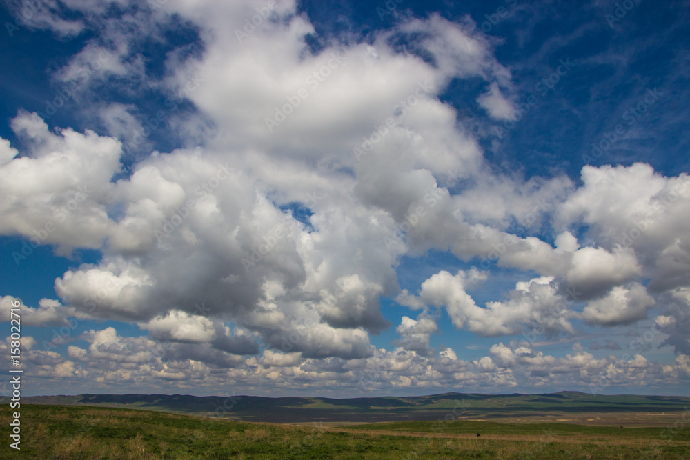 Steppe in spring, Kazakhstan. Amazing clouds and sky