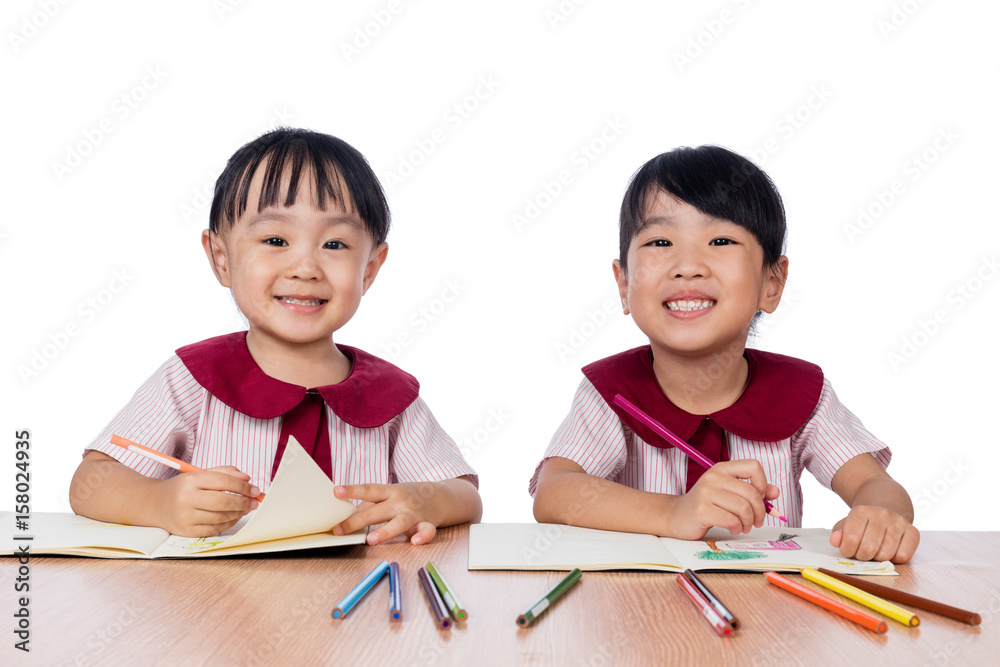 Asian Little Chinese girls drawing with color pencils Asian Little Chinese girls drawing with color pencils