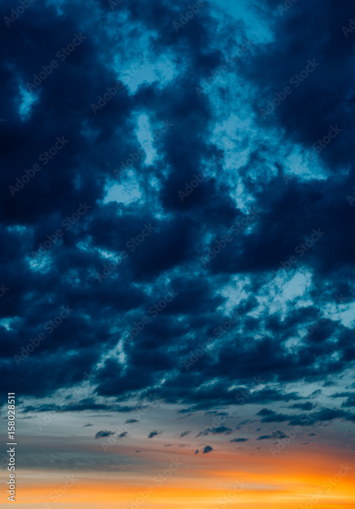 Dramatic sunset with dark moody clouds Dramatic sunset with dark moody clouds
