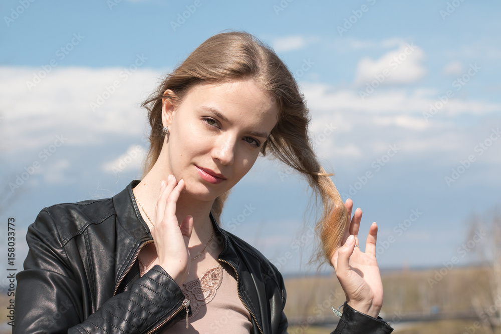 Girl with blond hair and blue sky and white cloud Girl with blond hair and blue sky and white cloud