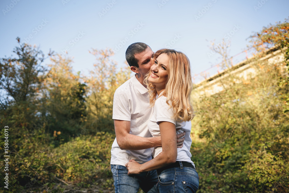 Romantic young couple in love together under the blue sky Romantic young couple in love together under the blue sky