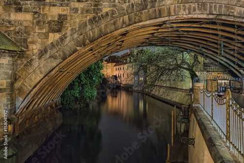 Charles Bridge and buildings along the Vltava at night