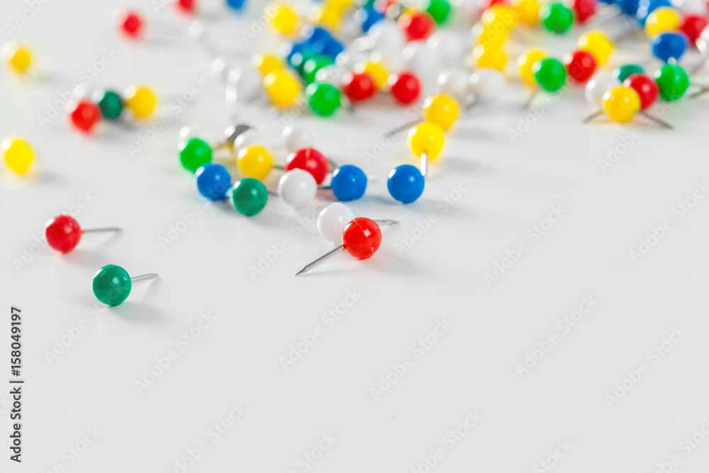 colorful color push pins isolated on white background