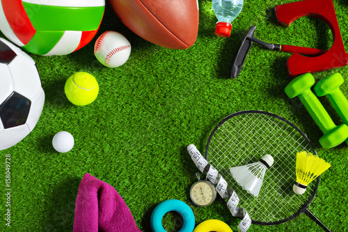 Fototapeta Naklejka Na Ścianę i Meble -  Various sport tools on grass