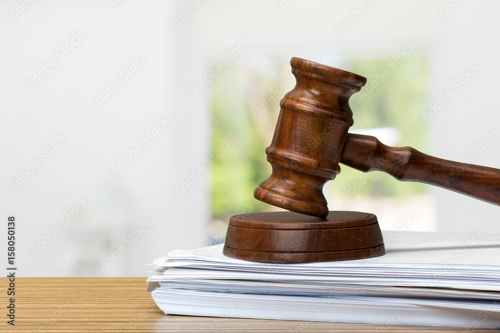 judge hammer on white paper and table judge hammer on white paper and table