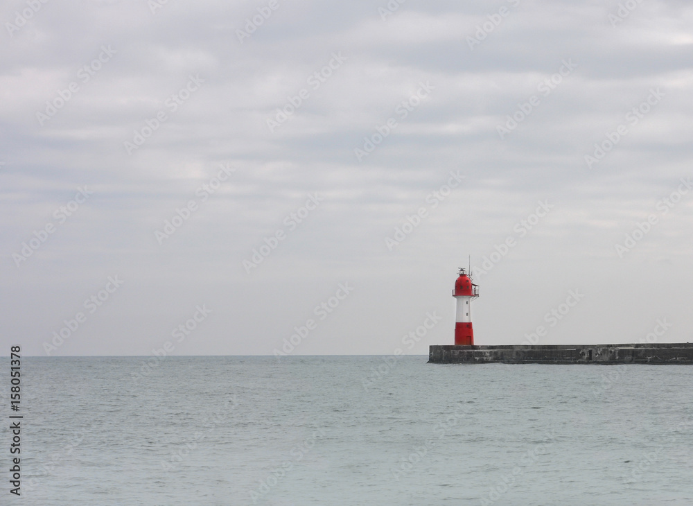 Red beacon on pier