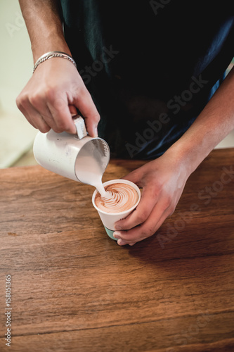 barista making coffee milk art