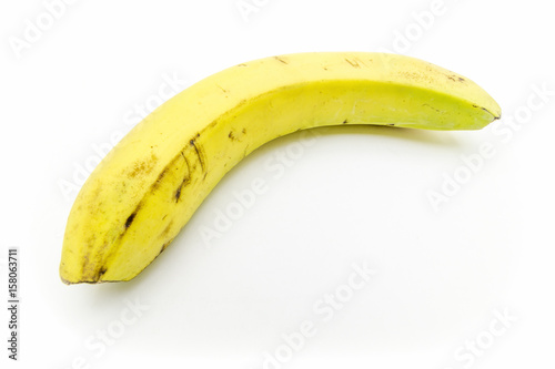 Ripe juicy banana close-up on a white background.