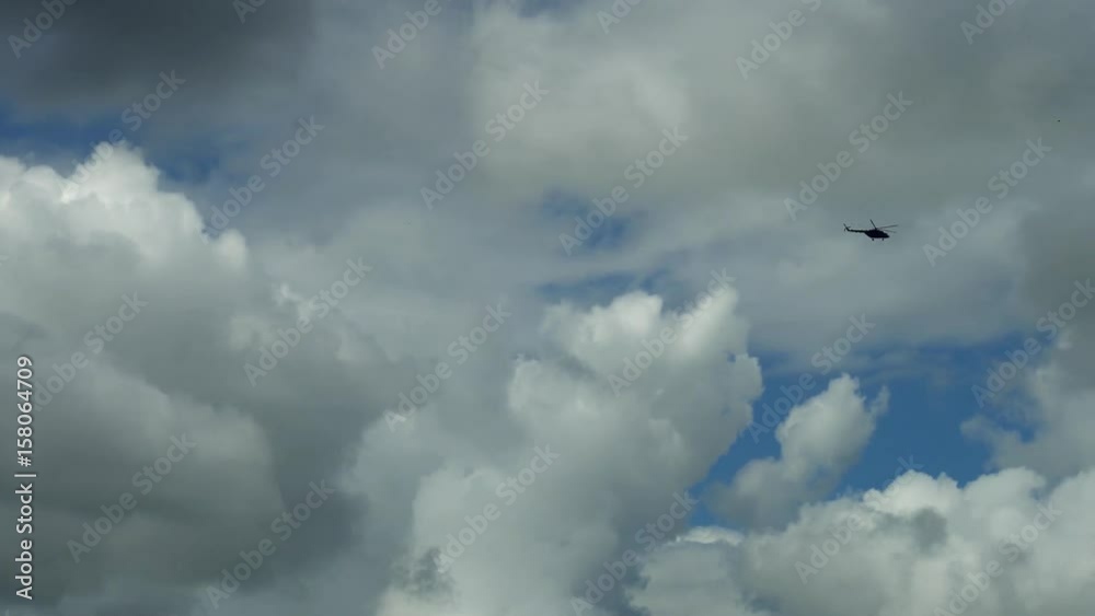 helicopter flying high in the sky in the far distance. helicopter flying high in the sky in the far distance.